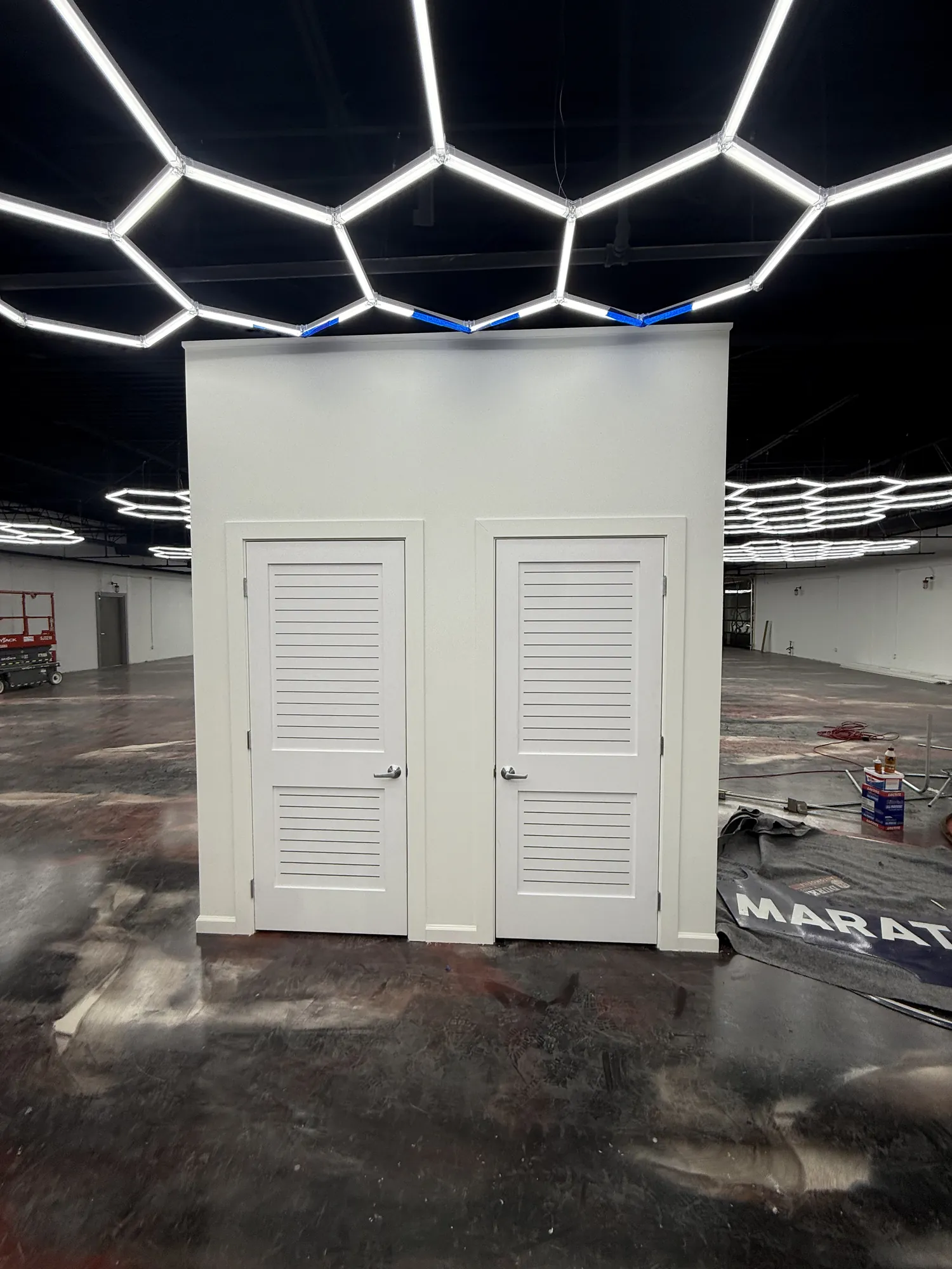 Completed freestanding drywall enclosure with cased openings