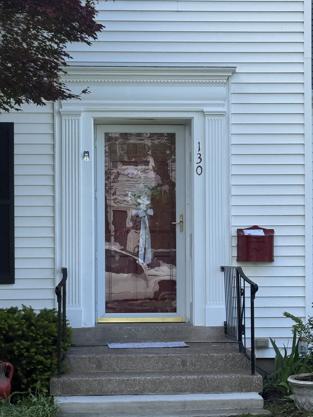 The finished entry with crisp pilasters and header.