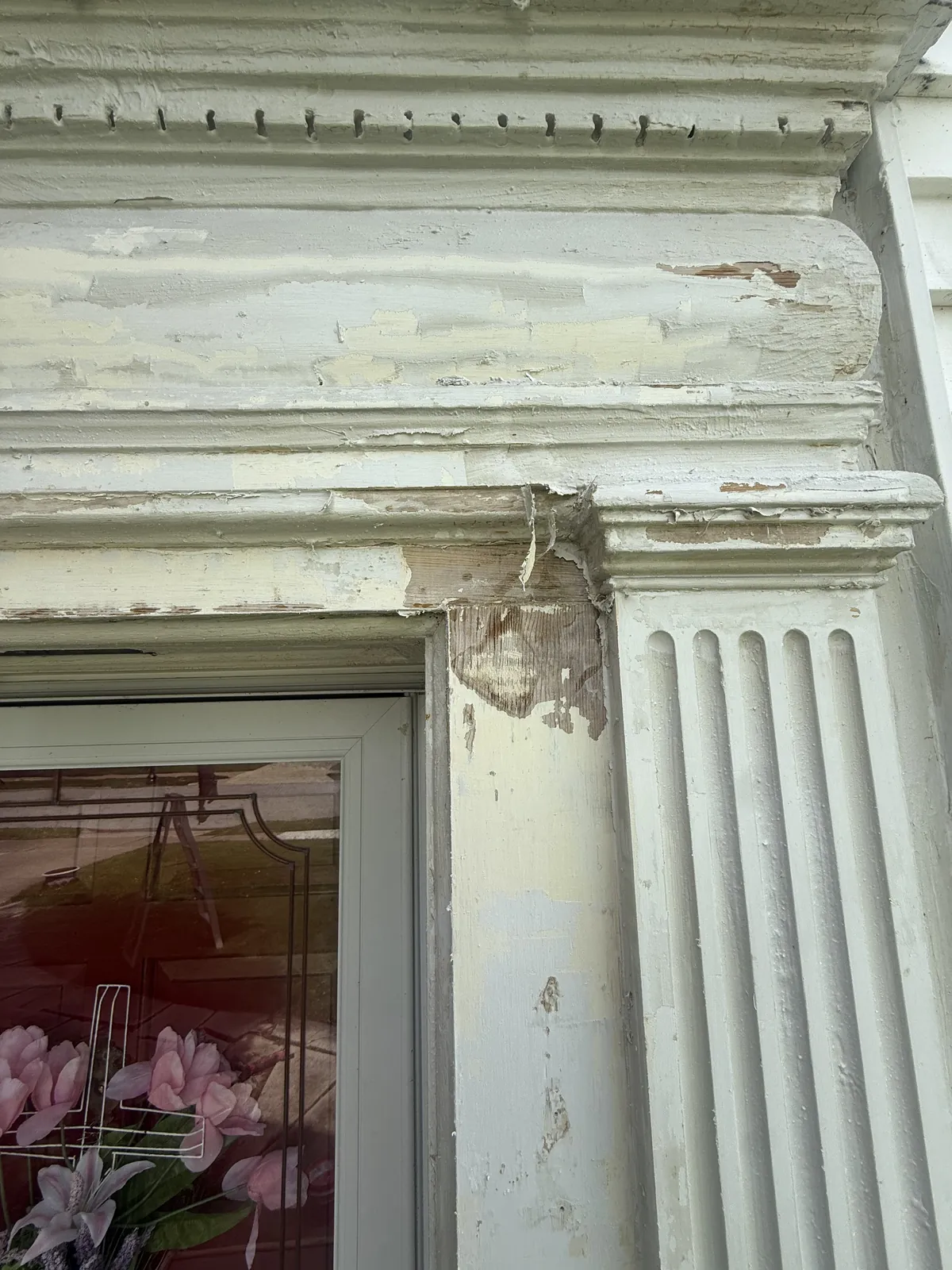 Peeling paint and weathered trim.