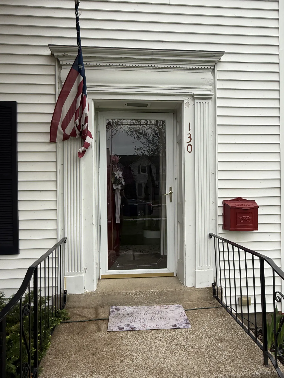 The entry before work began, with weathered paint.